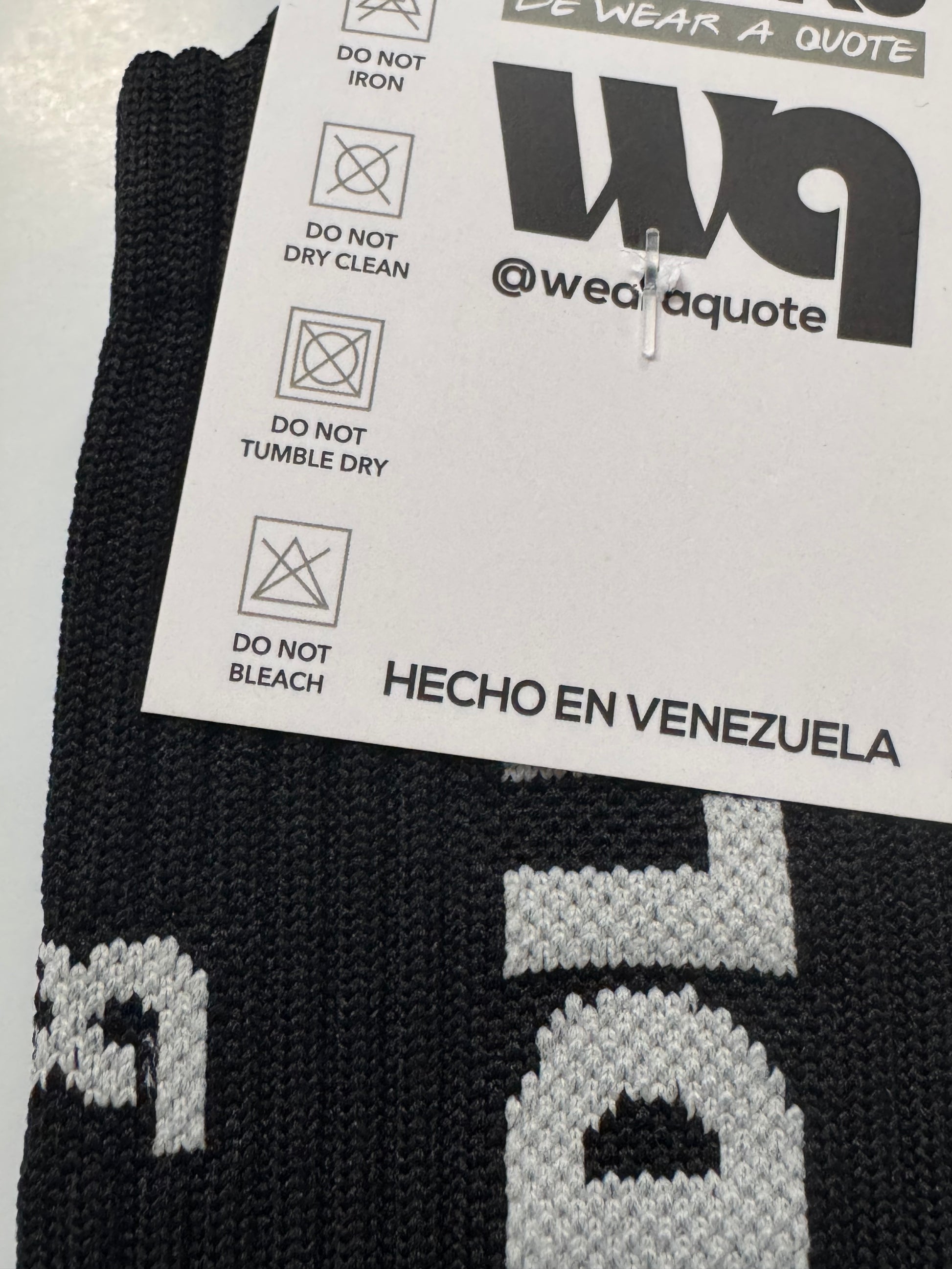 CDLM Negro WAQ socks — black compression tube socks flat lay